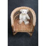 A wicker child's armchair and a Steiff Millennium mohair teddy bear