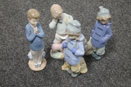 Four Nao figures of children