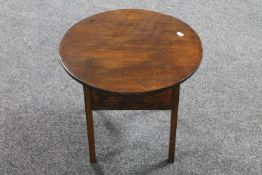 An early 20th century oak sewing table