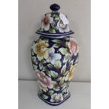 A hand painted pottery lidded vase initial F.V.