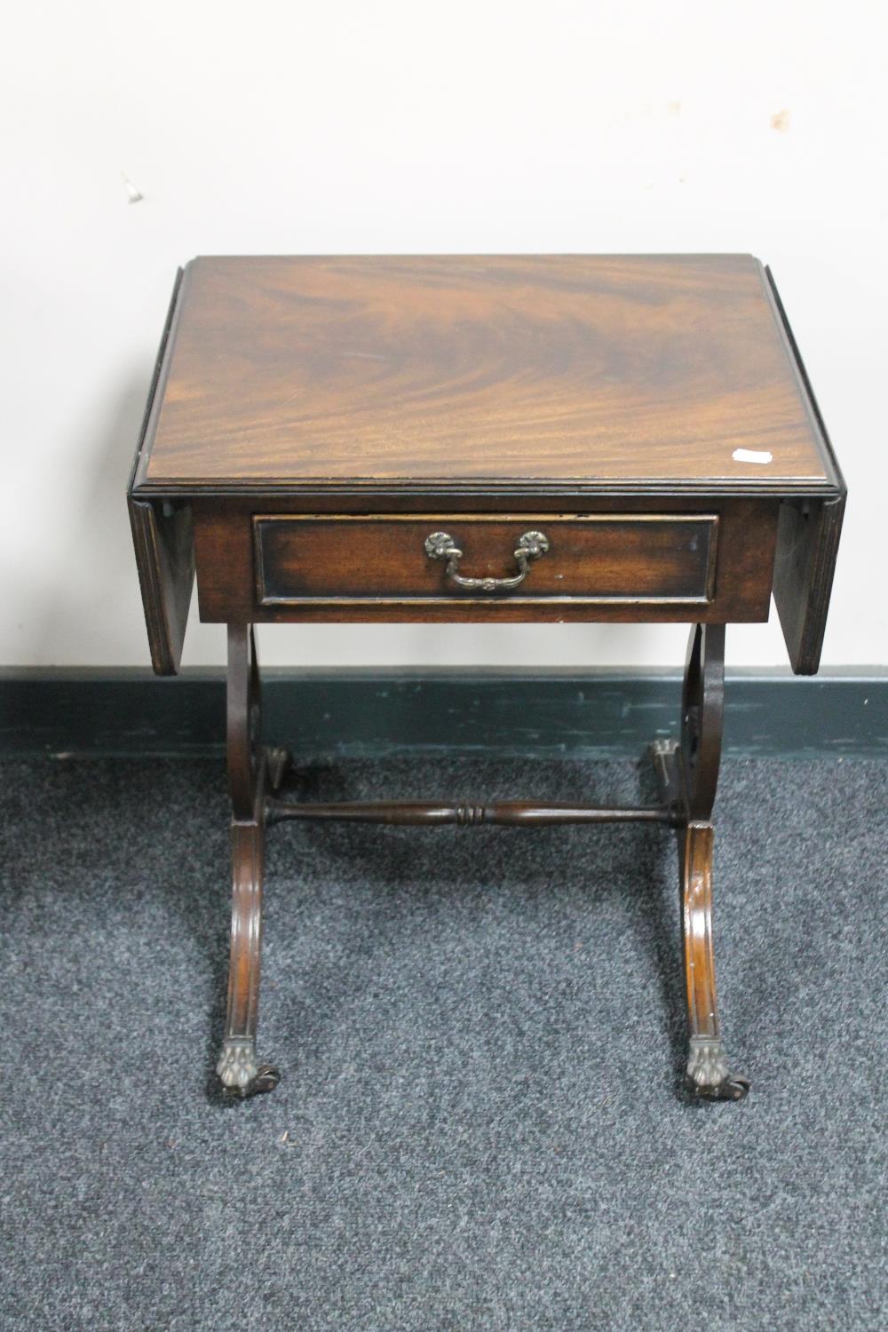 A reproduction mahogany telephone table