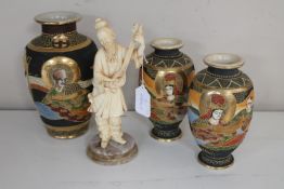 Three Japanese Satsuma vases and a Japanese figure of a man on marble base