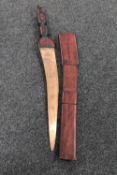 An African sword in leather scabbard