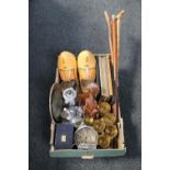 A box of plated wares, wooden clogs, picture frames, tribal hardwood figure,