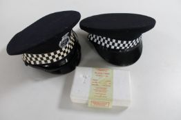 Two police hats and alcohol breath testing kit