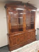 A high quality Charles Barr inlaid mahogany illuminated glazed bookcase,