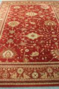 A John Lewis Royal Kesham carpet on red ground 366 cm x 274 cm