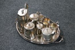 A plated twin handled gallery tray containing nine pieces of plated ware