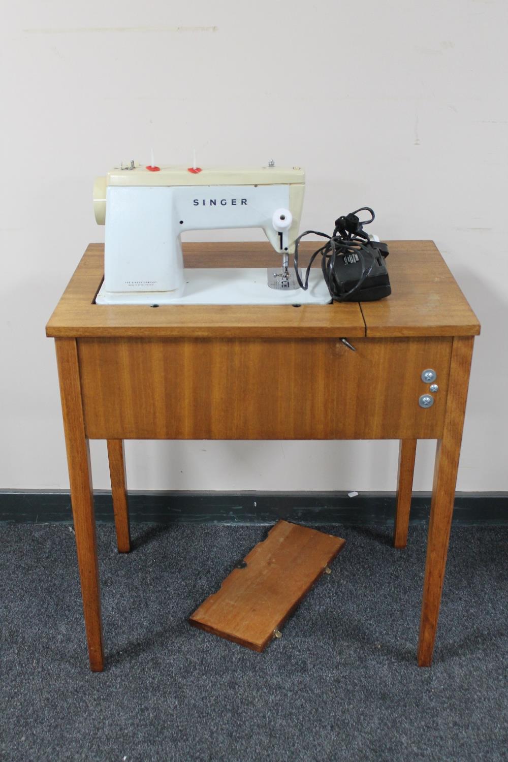 A Singer sewing machine in table