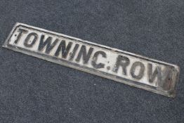 A metal street sign - Towning Row
