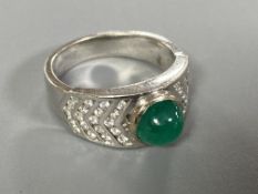 An 18ct white gold cabochon emerald and diamond ring, 6.