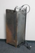 An early 20th century wrought iron adjustable floor lamp and an Art Deco two way folding screen