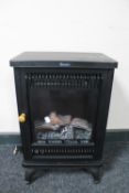 A Swan log effect electric fire in the form of a stove (in perfect working order)