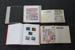 Four albums of stamps