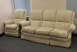 A contemporary three seater settee with matching armchair with two tone cream fabric