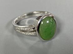 An 18ct white gold jade and diamond ring, 6.68g.