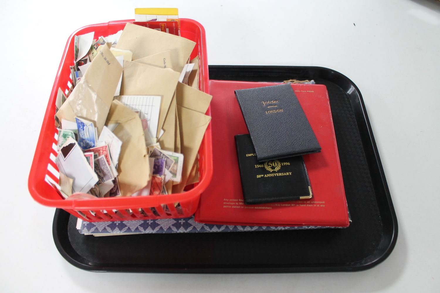 A tray of loose stamps, two albums of black and white photos relating to ships, aircraft etc,