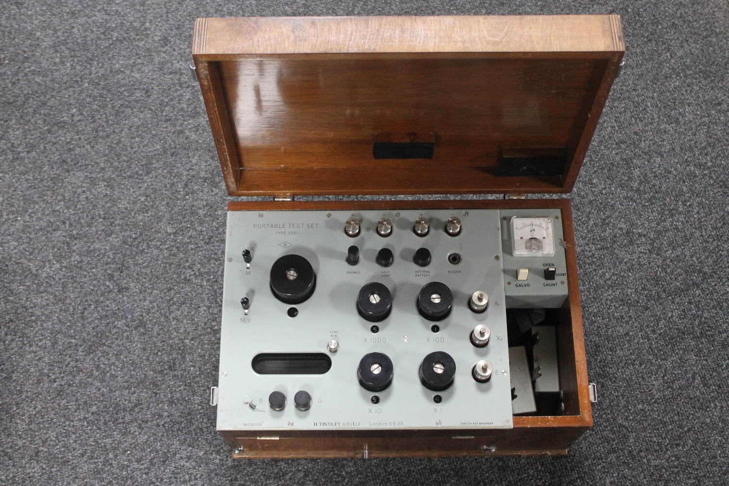 A portable electric test set in wooden box