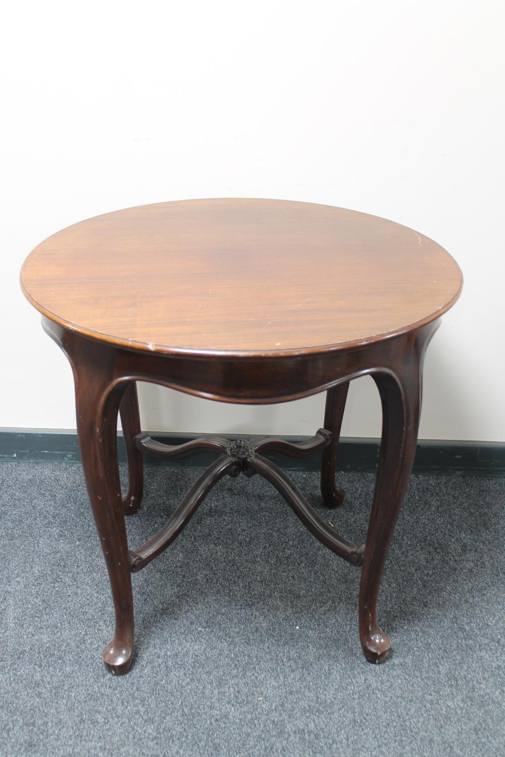 A 20th century continental mahogany occasional table