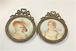 A pair of early 19th century portrait miniatures on ivory, diameter 4.