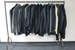 A rail of assorted gent's jackets and suits, casual and formal including Armani, Hugo Boss,