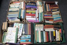 Four boxes of early twentieth century and later hard backed books - novels and reference etc