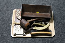 A tray of brushes, brass shoe horn,