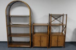 A set of three wooden and wicker shelves