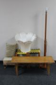 A teak standard lamp with shade together with a pair of wicker upholstered stools,