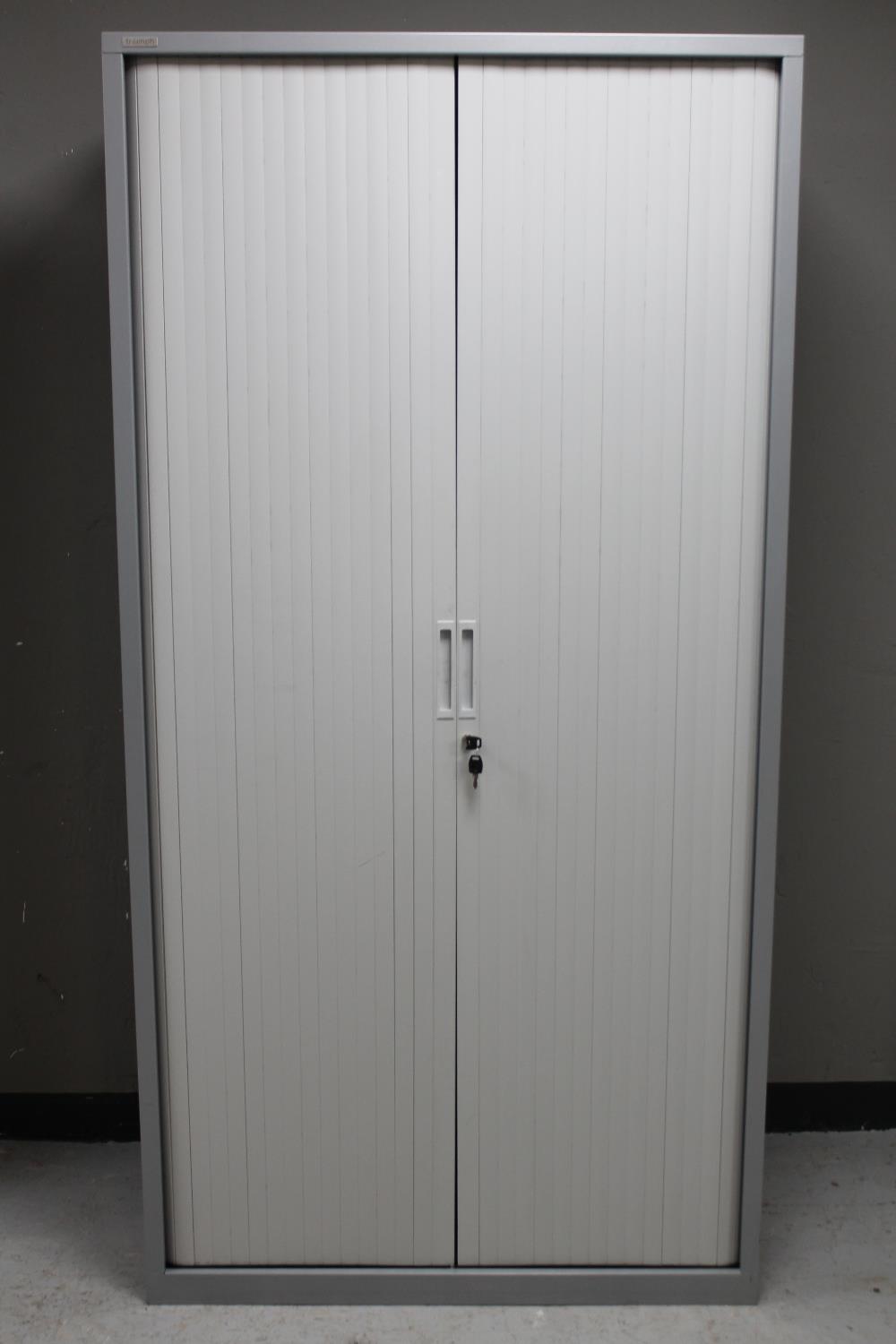 A Triumph metal shutter door office stationary cabinet with key