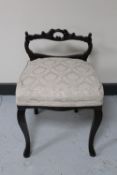 An antique mahogany dressing table chair