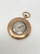 A 9ct gold slim half-hunter pocket watch retailed by C.B.