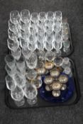 Two trays of drinking glasses,