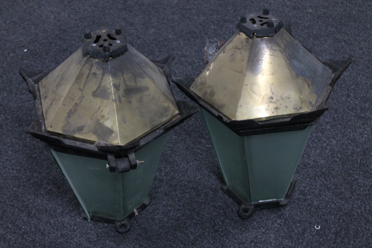 A pair of cast iron and brass coach lights
