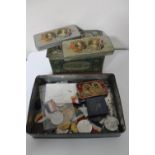 A collection of tins and medals relating to Royal Coronations,