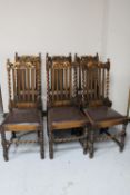 A set of six antique oak barley twist rail backed chairs
