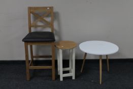 A contemporary oak breakfast bar chair together with a stool and circular occasional table