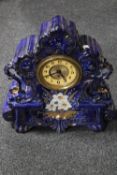 An ornate Victorian pottery mantel clock