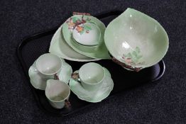 A tray of two Carlton ware cups and saucers together with a matching Carlton ware milk jug,