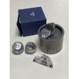A boxed Swarovski crystal heart paperweight together with two further paperweights 'Sazsburg' with