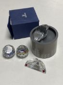 A boxed Swarovski crystal heart paperweight together with two further paperweights 'Sazsburg' with