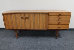 A mid twentieth century teak Portwood furniture sideboard