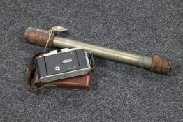 An early twentieth century Japanese nautical telescope together with camera in leather case