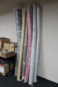 Ten assorted rolls of fabric
