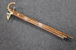 A bundle of six antique walking and swagger sticks (two silver mounted)