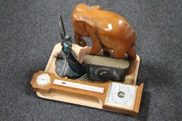 A tray of carved hardwood elephant, barometer, pens,