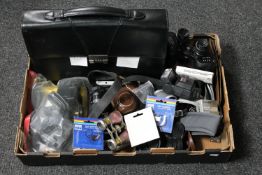 A basket of Ajax 10 x 50 binoculars, opera glasses, Nikon camera, camera accessories,