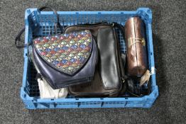 A basket of two handbags together with a clutch bag