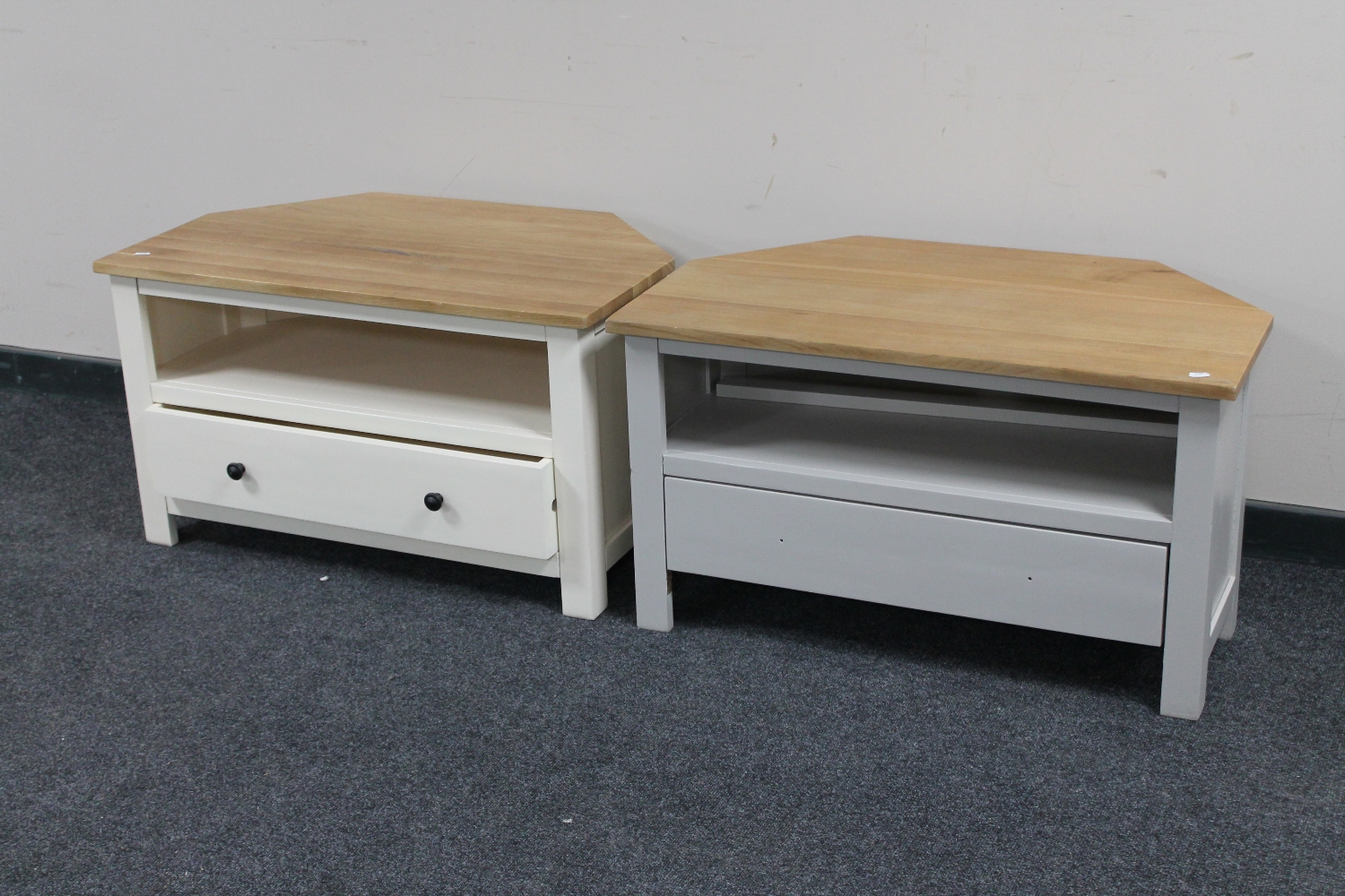 A pair of contemporary oak topped corner TV stands