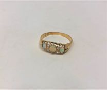 A Victorian 18ct gold opal and diamond ring, size S CONDITION REPORT: 3.